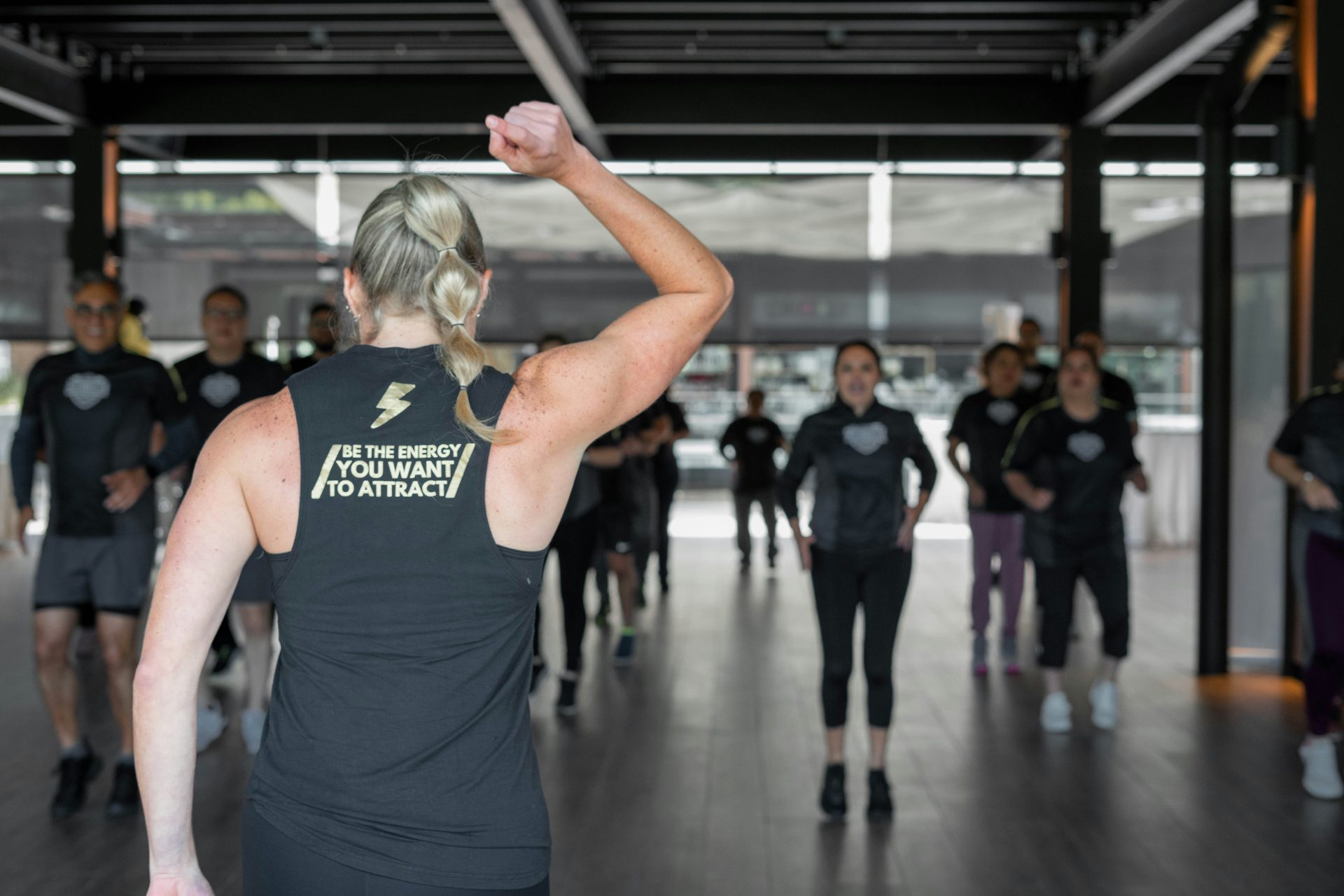 a group of people in a gym doing exercises